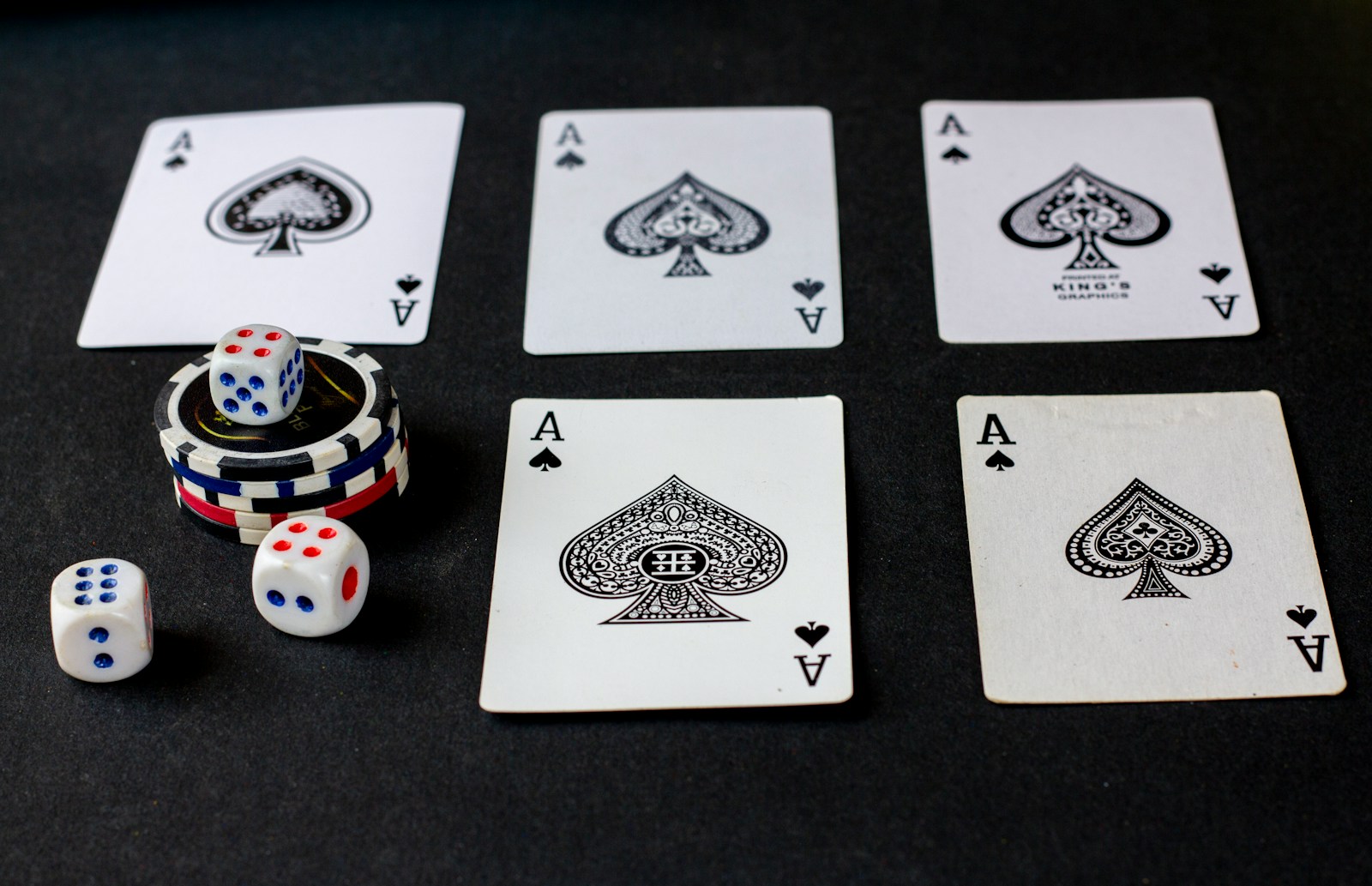 playing cards and dice on a table